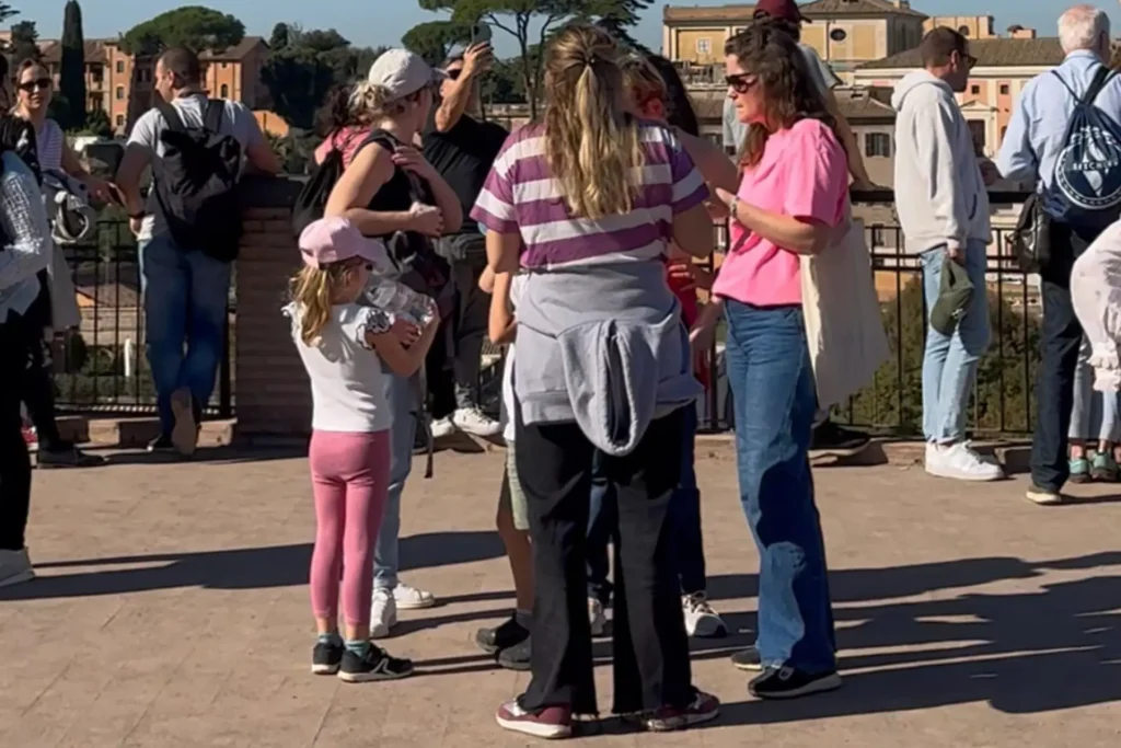 Family group listening to a guide during the Colosseum tour for kids