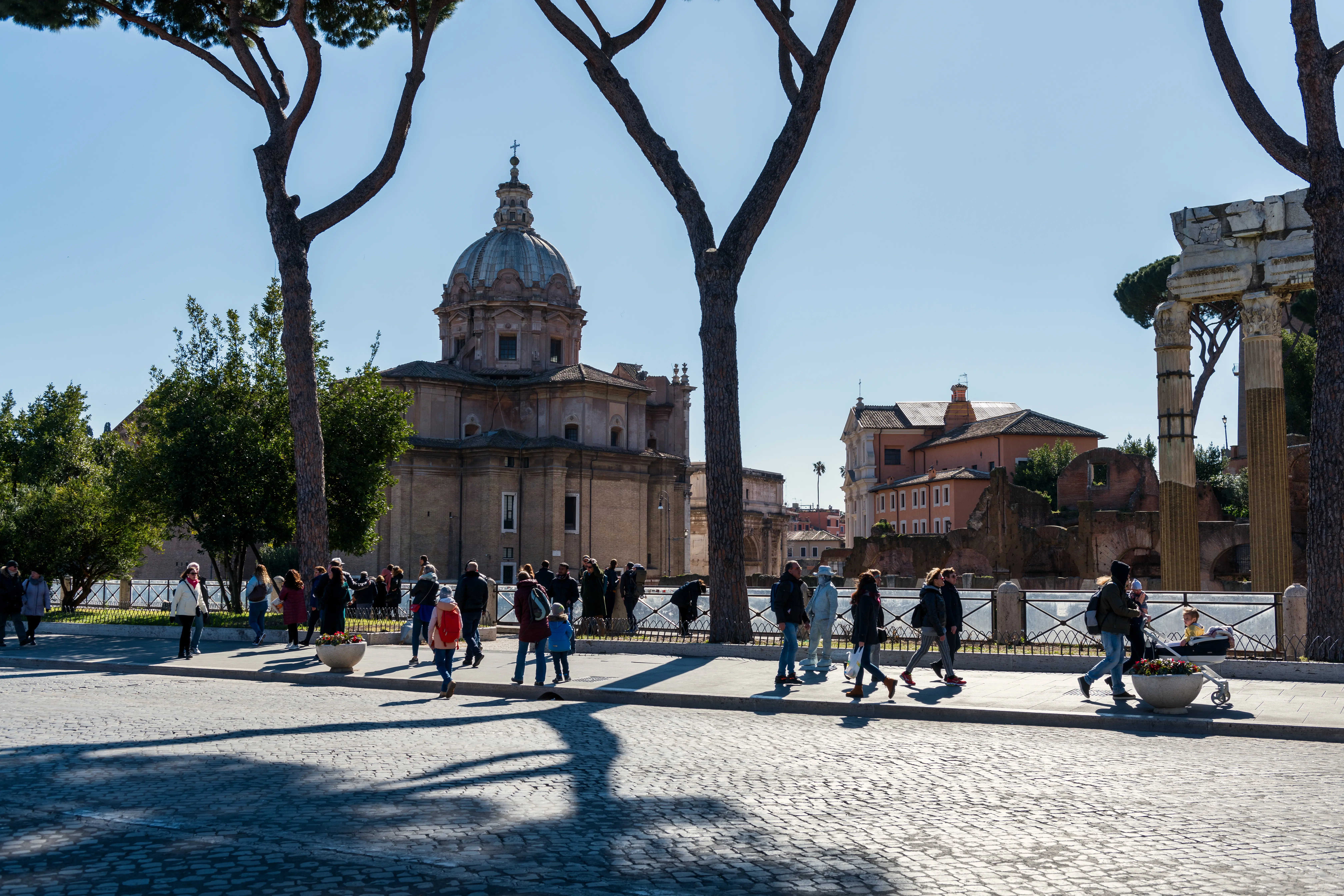 Families visiting the Roman Forum during the Colosseum tour for kids