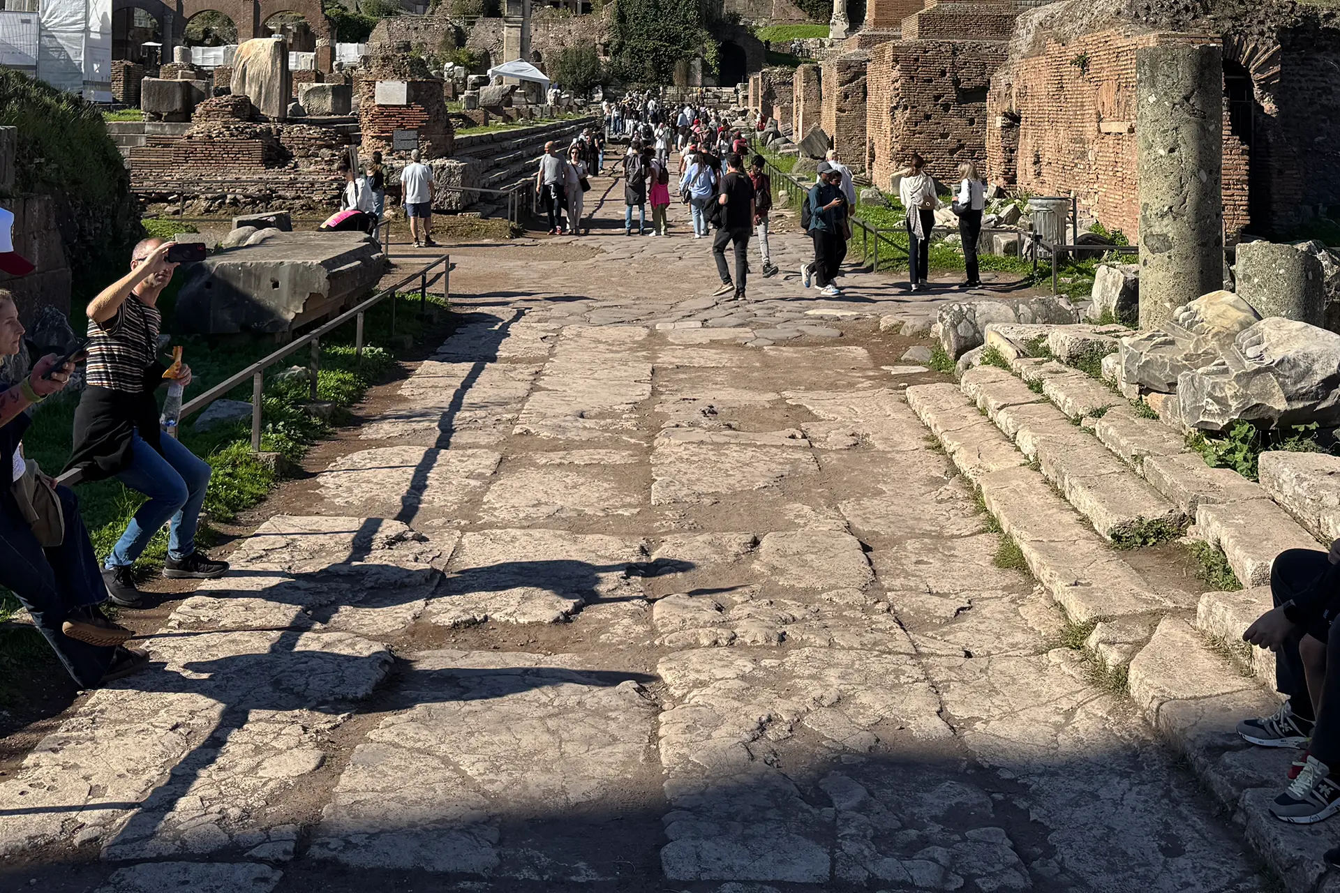 Visitors walking through the Roman Forum during the Colosseum guided tour